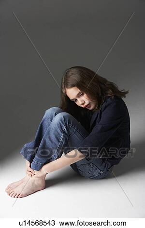Thoughtful Girl Sitting In Studio View Large Photo Image Stock Image - Thoughtful Girl Sitting In Studio. Fotosearch