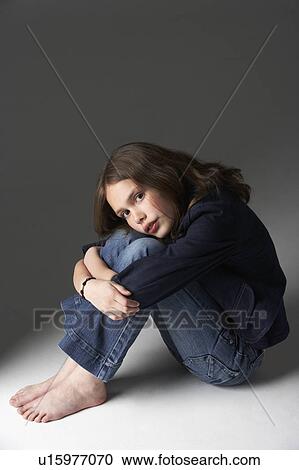 Thoughtful Girl Sitting In Studio View Large Photo Image Stock Image - Thoughtful Girl Sitting In Studio. Fotosearch