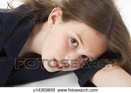 Thoughtful Girl Sitting In Studio View Large Photo Image Stock Photo - Thoughtful Girl Sitting In Studio. Fotosearch