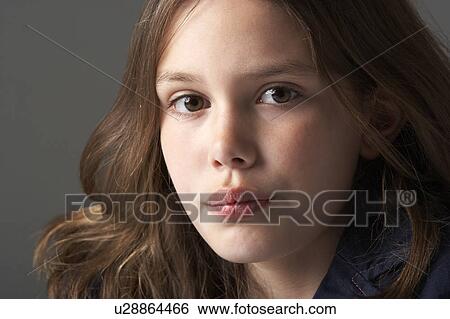 Thoughtful Girl Sitting In Studio View Large Photo Image Stock Photograph - Thoughtful Girl Sitting In Studio. Fotosearch