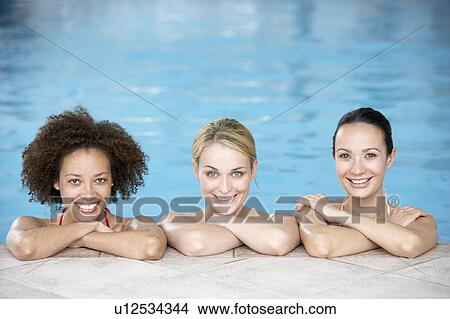 Three Female Friends In Swimming Pool View Large Photo Image Picture - Three Female Friends In Swimming Pool. Fotosearch