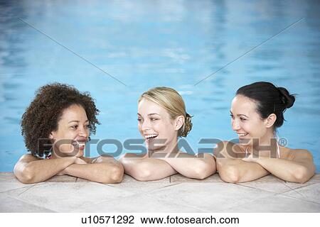 Three Female Friends In Swimming Pool View Large Photo Image Stock Image - Three Female Friends In Swimming Pool. Fotosearch