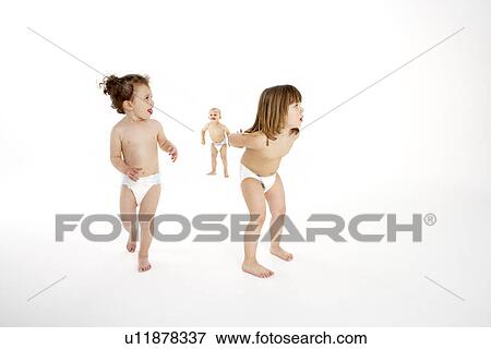 Stock Photo - Three Young Children Playing In Studio. Fotosearch