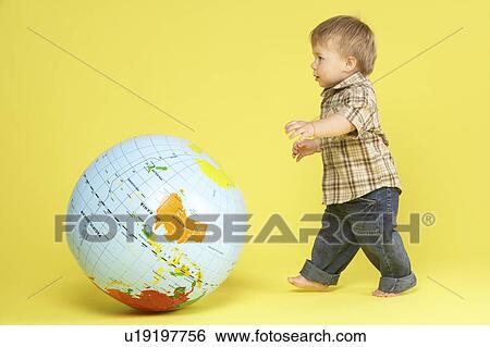 Toddler In Studio With Globe View Large Photo Image Stock Photograph - Toddler In Studio With Globe. Fotosearch