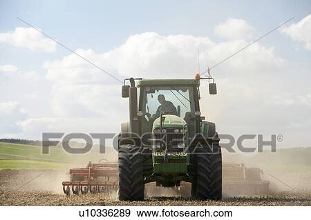 Stock Photo - Tractor Preparing Soil. Fotosearch