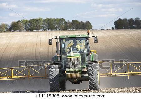 Tractor Spraying Field View Large Photo Image Stock Photo - Tractor Spraying Field. Fotosearch