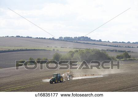 Stock Photo - Tractor Spraying Field. Fotosearch