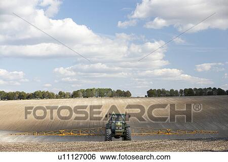 Tractor Spraying Field View Large Photo Image Stock Photograph - Tractor Spraying Field. Fotosearch