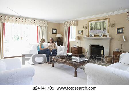 Two Women Relaxing In Lounge View Large Photo Image Stock Photography - Two Women Relaxing In Lounge. Fotosearch