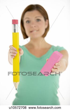 Stock Photo - Woman Holding Big Pencil And Eraser. Fotosearch