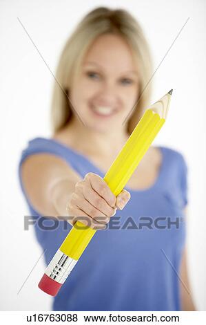 Woman Holding Big Pencil View Large Photo Image Stock Photo - Woman Holding Big Pencil. Fotosearch