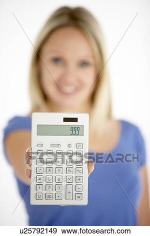 Stock Photo - Woman Holding Calculator. Fotosearch