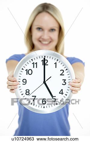 Woman Holding Clock Showing 5 O'Clock View Large Photo Image Stock Image - Woman Holding Clock Showing 5 O'Clock. Fotosearch