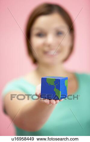 Woman Holding Cube Shaped Globe View Large Photo Image Stock Photo - Woman Holding Cube Shaped Globe. Fotosearch