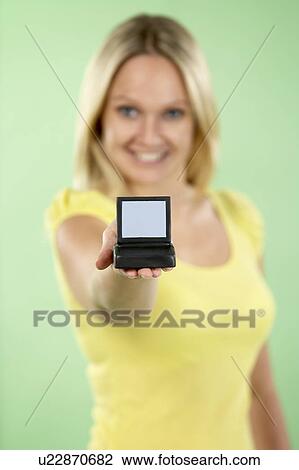 Stock Image - Woman Holding Model Computer. Fotosearch