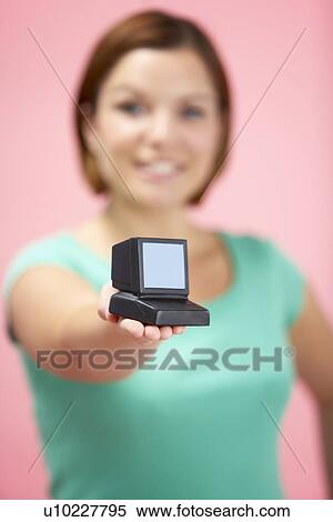Stock Photography - Woman Holding Model Computer. Fotosearch
