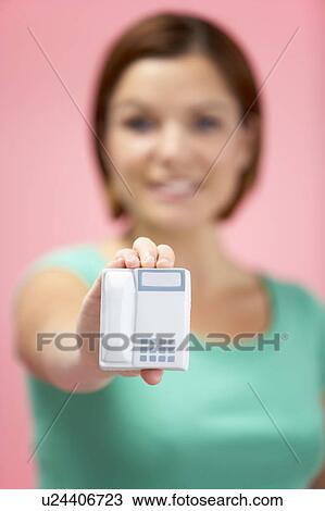 Stock Image - Woman Holding Model Telephone. Fotosearch