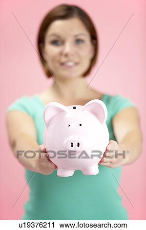 Woman Holding Piggy Bank View Large Photo Image Stock Image - Woman Holding Piggy Bank. Fotosearch
