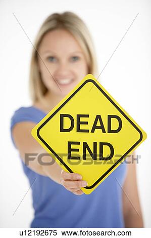 Stock Photography - Woman Holding Road Traffic Sign. Fotosearch