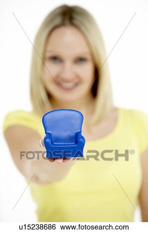 Woman Holding Small Armchair View Large Photo Image Stock Photograph - Woman Holding Small Armchair. Fotosearch
