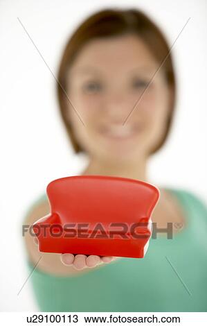 Woman Holding Small Sofa View Large Photo Image Stock Image - Woman Holding Small Sofa. Fotosearch