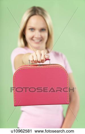 Stock Image - Woman Holding Suitcase. Fotosearch