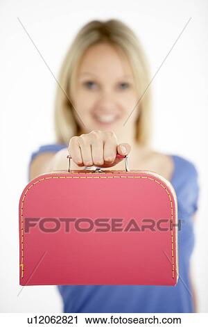 Stock Image - Woman Holding Suitcase. Fotosearch