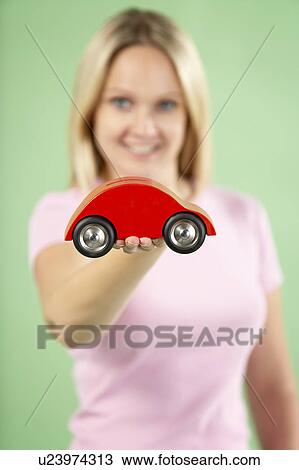 Woman Holding Toy Car View Large Photo Image Stock Image - Woman Holding Toy Car. Fotosearch