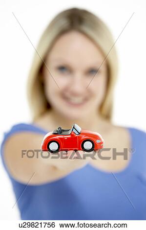 Woman Holding Toy Car View Large Photo Image Stock Photograph - Woman Holding Toy Car. Fotosearch