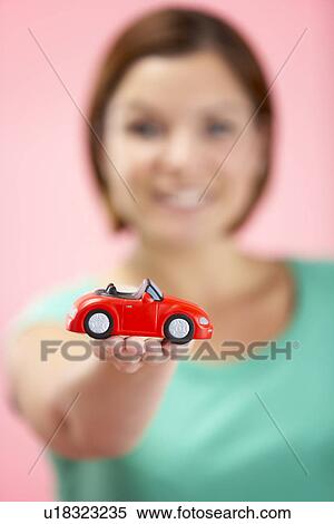 Woman Holding Toy Car View Large Photo Image Stock Photography - Woman Holding Toy Car. Fotosearch