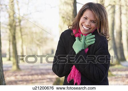 Stock Photograph - Woman On Autumn Walk. Fotosearch