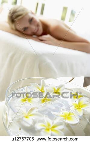 Woman On Massage Table With Flowers In Foreground View Large Photo Image Stock Photography - Woman On Massage Table With Flowers In Foreground. Fotosearch