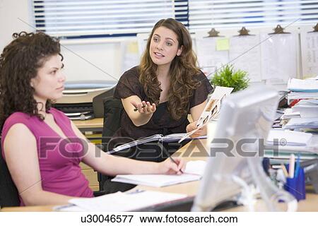 Women having an argument at work View Large Photo Image Stock Photo - Women having an argument at work. Fotosearch