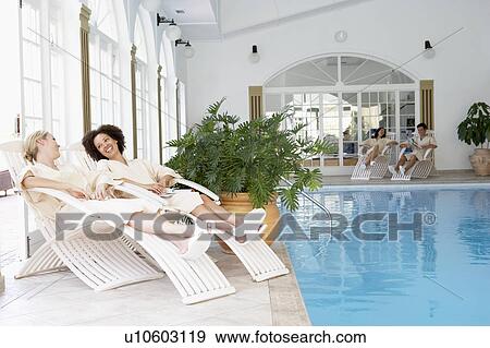 Women Relaxing Around Pool At Spa View Large Photo Image Stock Photo - Women Relaxing Around Pool At Spa. Fotosearch