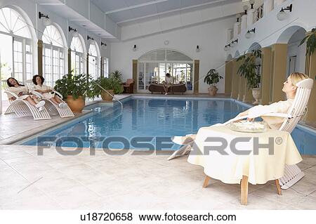 Women Relaxing Around Pool At Spa View Large Photo Image Stock Photo - Women Relaxing Around Pool At Spa. Fotosearch