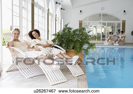 Women Relaxing Around Pool At Spa View Large Photo Image Stock Photo - Women Relaxing Around Pool At Spa. Fotosearch