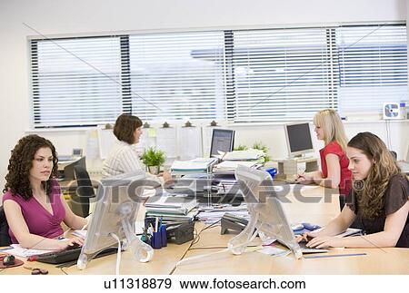 Women working in an office View Large Photo Image Stock Photo - Women working in an office. Fotosearch