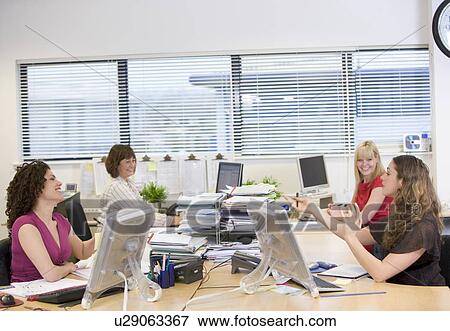 Women working in an office View Large Photo Image Stock Photo - Women working in an office. Fotosearch