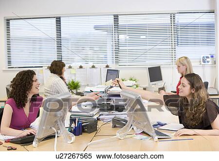 Women working in an office View Large Photo Image Stock Photography - Women working in an office. Fotosearch
