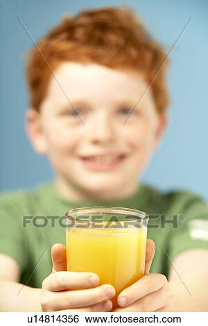 Young Boy Holding Glass Of Juice View Large Photo Image Stock Photograph - Young Boy Holding Glass Of Juice. Fotosearch