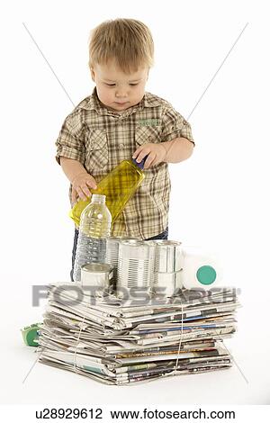 Stock Image - Young Boy Recycling In Studio. Fotosearch
