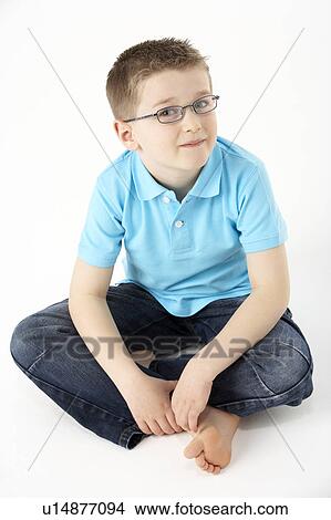 Young Boy Sitting In Studio View Large Photo Image Picture - Young Boy Sitting In Studio. Fotosearch