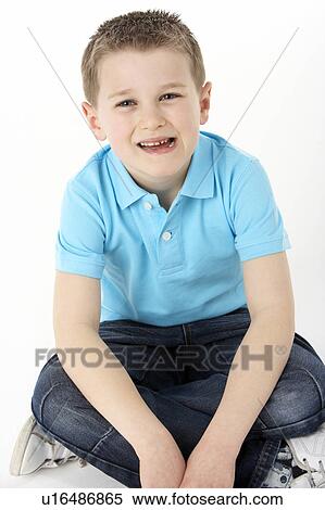 Young Boy Sitting In Studio View Large Photo Image Stock Photography - Young Boy Sitting In Studio. Fotosearch