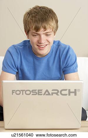 Young Boy Using Laptop At Home View Large Photo Image Stock Image - Young Boy Using Laptop At Home. Fotosearch