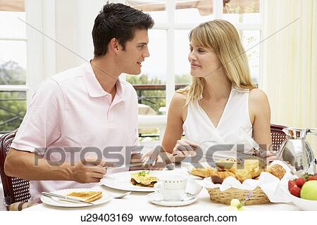 Young Couple Enjoying Hotel Breakfast View Large Photo Image Stock Photo - Young Couple Enjoying Hotel Breakfast. Fotosearch