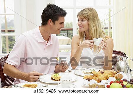 Young Couple Enjoying Hotel Breakfast View Large Photo Image Stock Photograph - Young Couple Enjoying Hotel Breakfast. Fotosearch