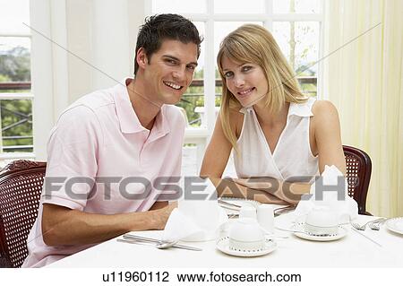 Young Couple Enjoying Hotel Meal View Large Photo Image Stock Image - Young Couple Enjoying Hotel Meal. Fotosearch