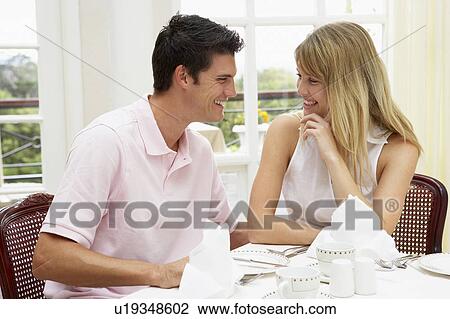 Stock Image - Young Couple Enjoying Hotel Meal. Fotosearch