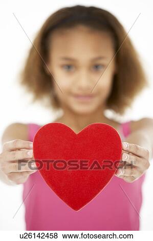 Stock Photo - Young Girl Holding Heart. Fotosearch