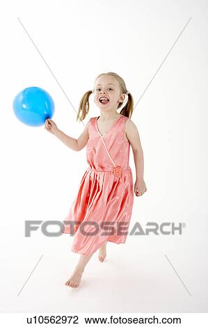 Stock Image - Young Girl Holding Party Balloon. Fotosearch